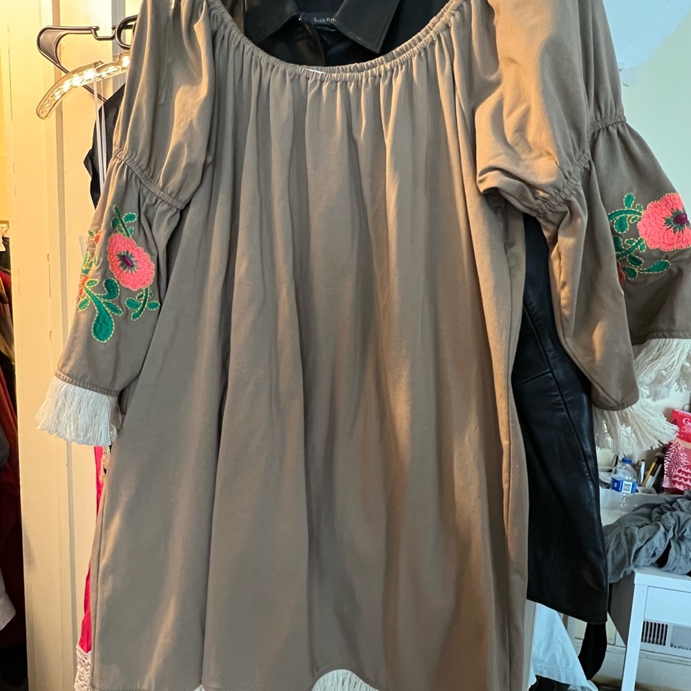UMGEE boutique dress featuring embroidery and fringe
